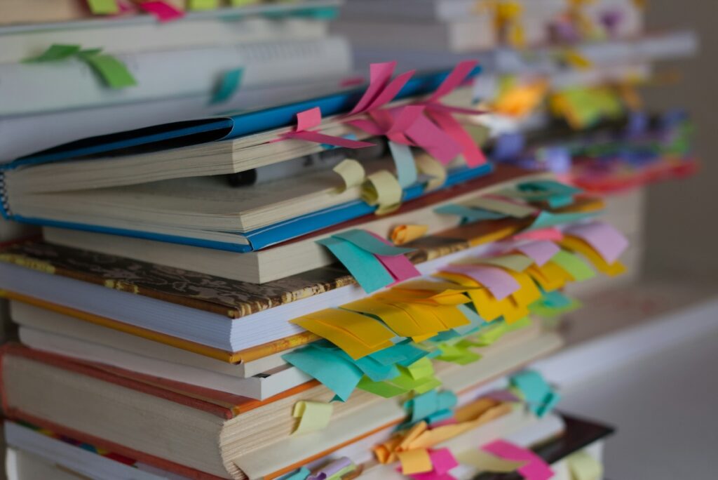 stack of books with tabs on the pages