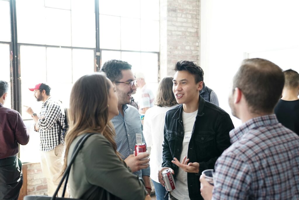 group of students chat happily