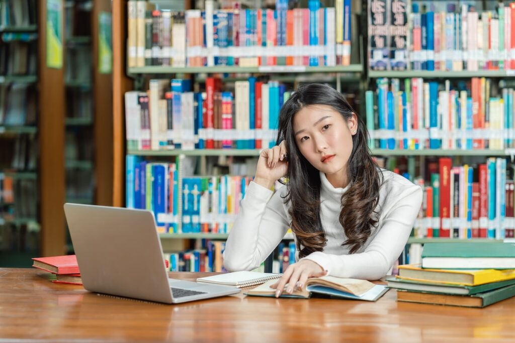 student studying for the GMAT in library
