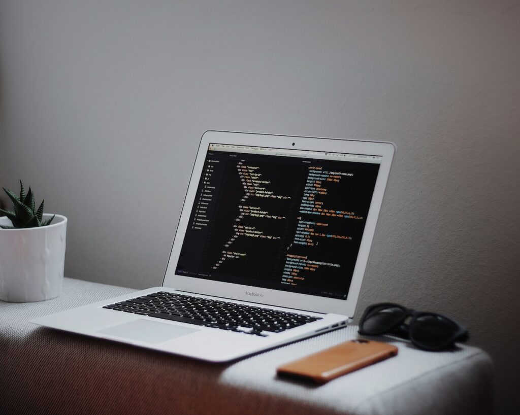 laptop with code showing on the screen