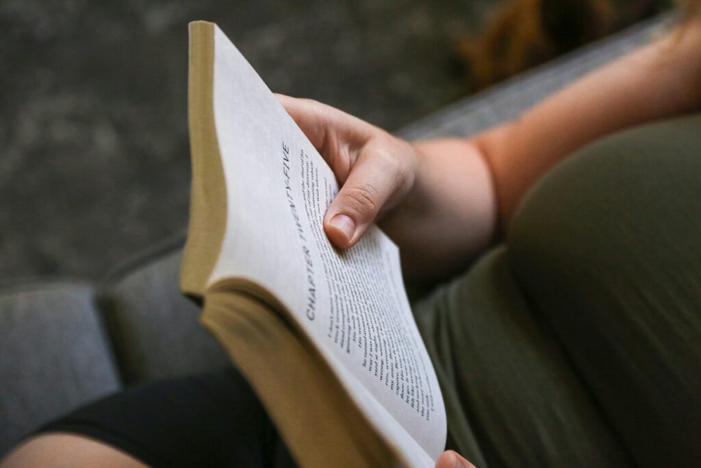 hand holding book open