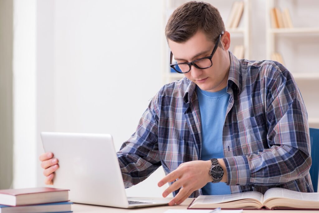 Young student studying over internet