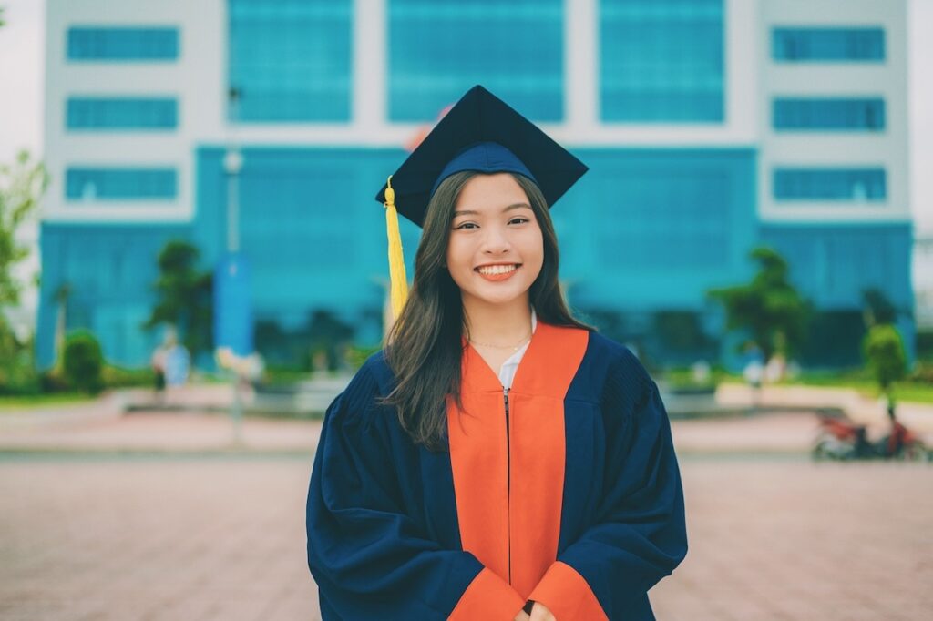 female graduate in cap and gown