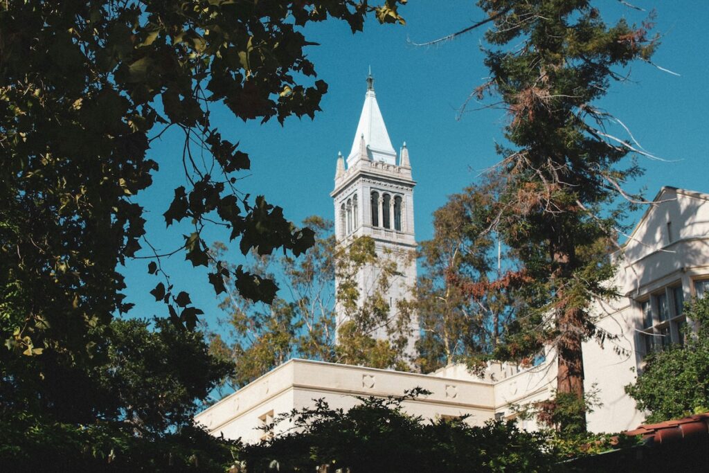 clocktower at UC Berkeley captured looking through trees