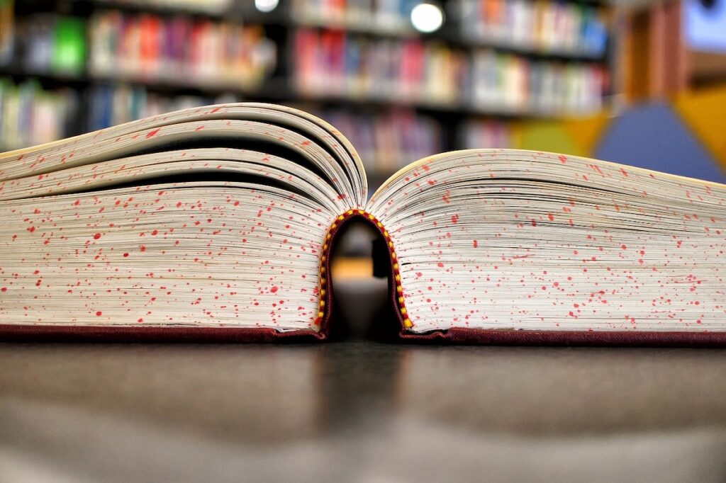 open book on a desk in a library