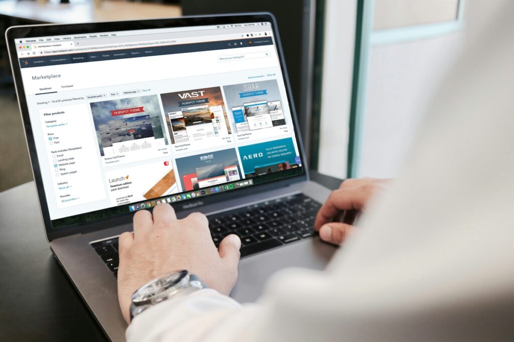 person builds website on laptop