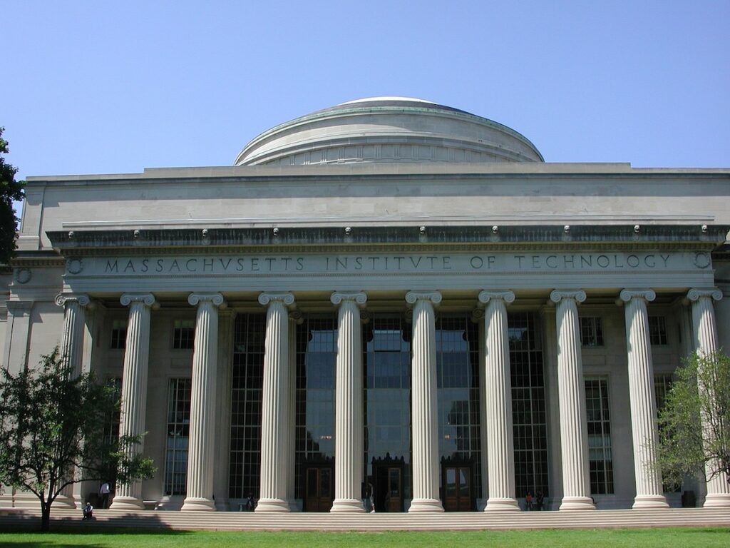 building with stone pillars and carving reading Massachusetts Institute of Technology