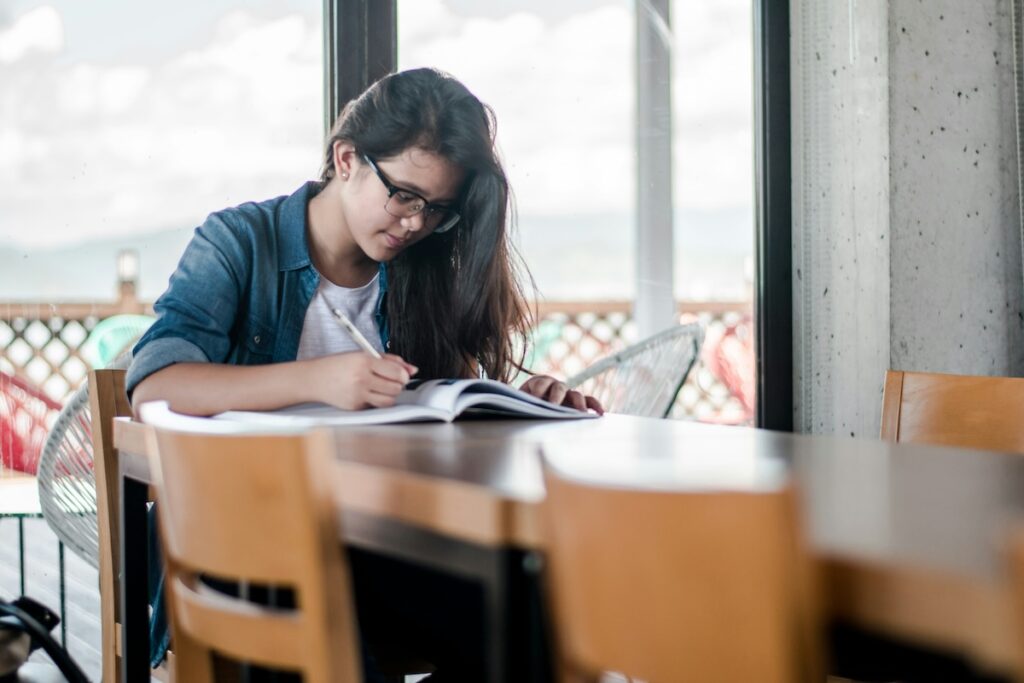 woman works on medical school application
