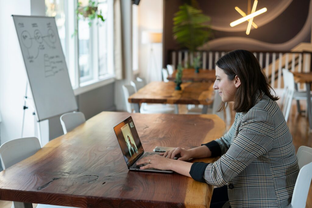 woman takes zoom interview at office desk