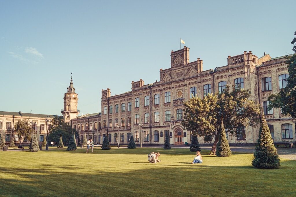 university building with large lawn in front of it