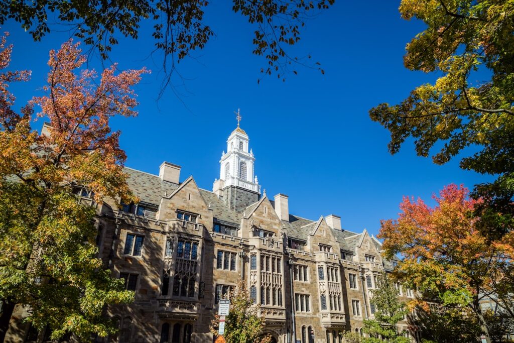 looking up against brick facade of Yale University building