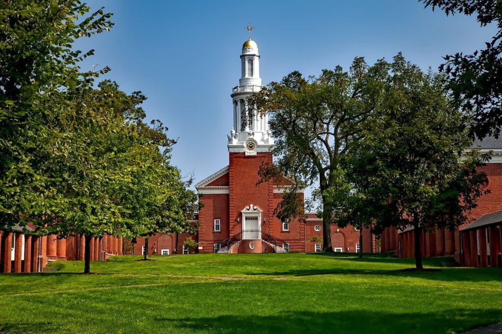 brick building at Yale University seen across the lawn