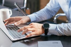 man working on laptop at a desk