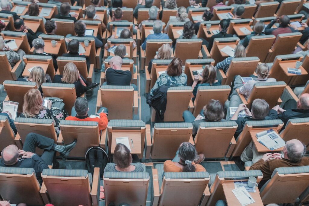 students at desks in university classroom