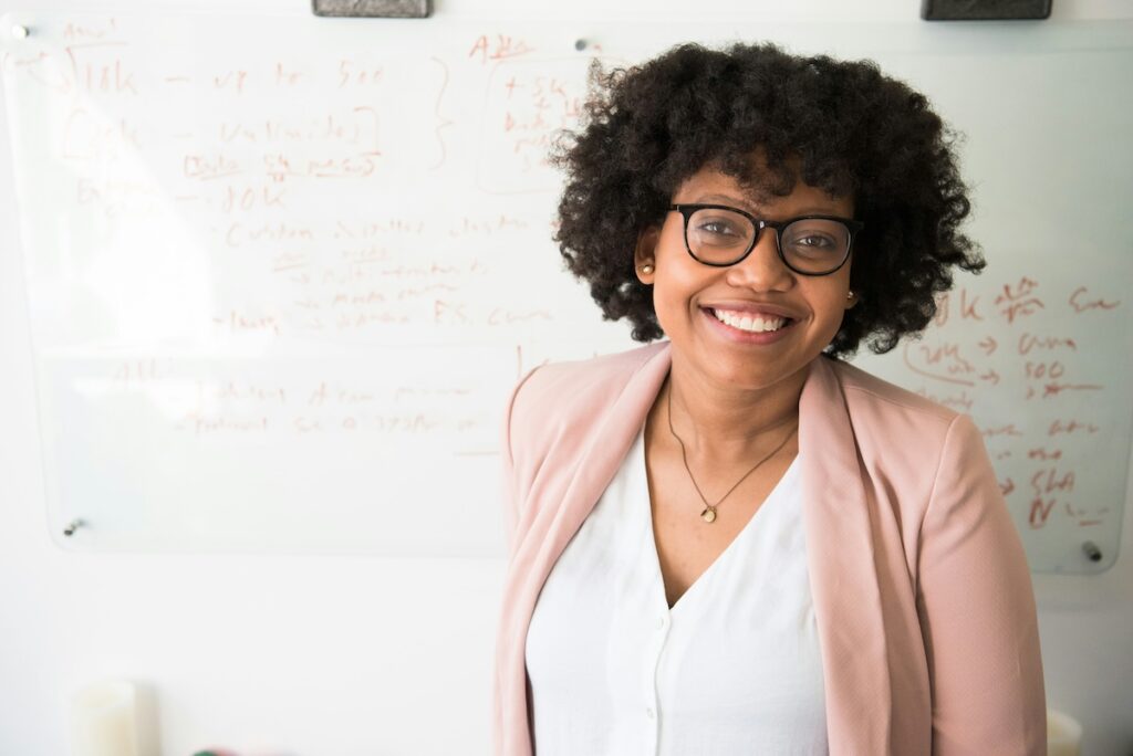 professional woman in peach blazer