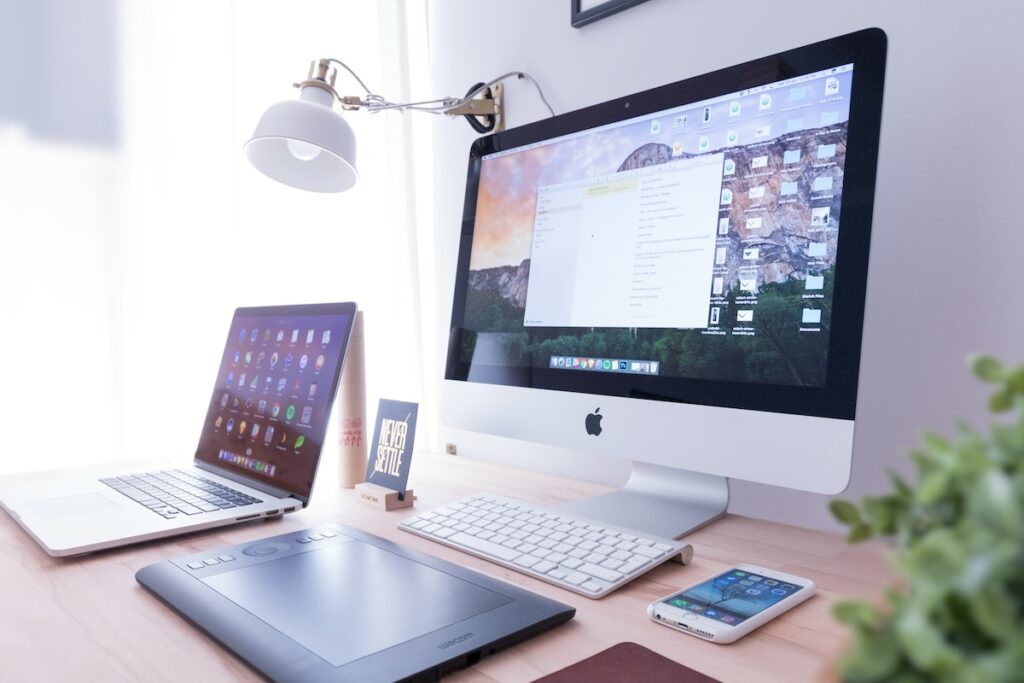 desktop with macbook, imac and tablet lined up