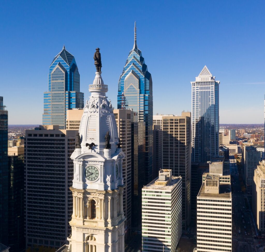 Statue of Ben Franklin looks over the city streets of Philadelphia PA