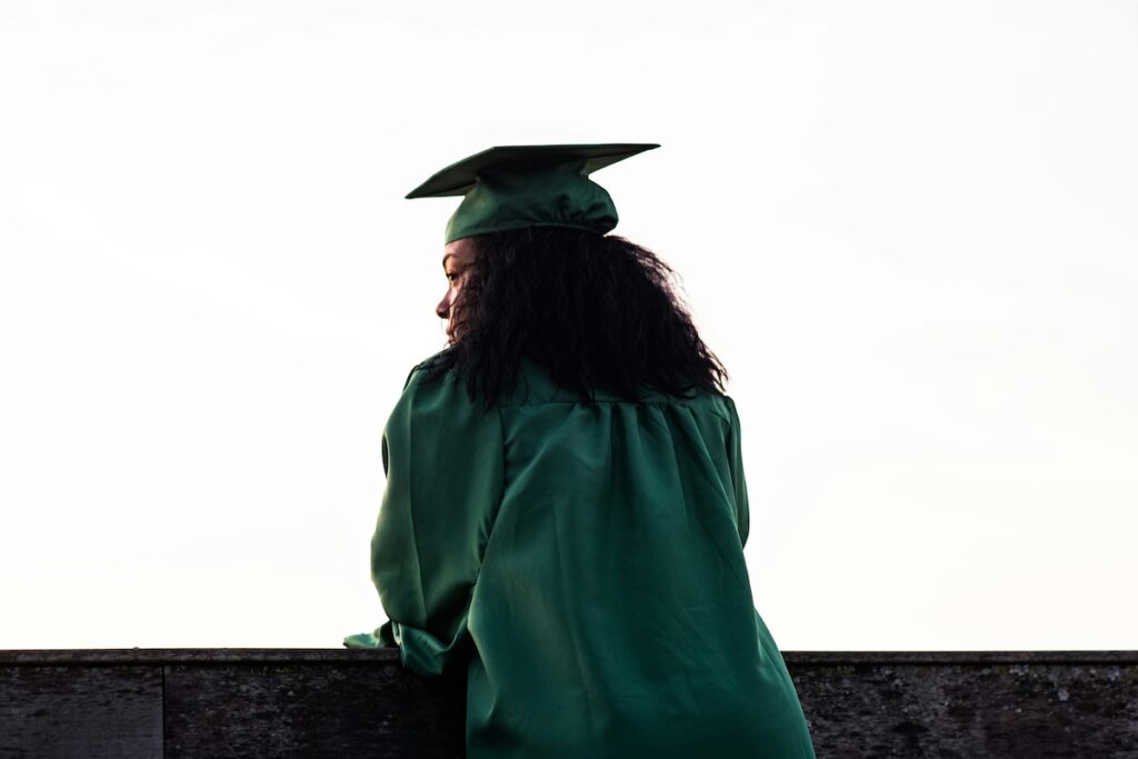 woman wearing graduate cap and gown