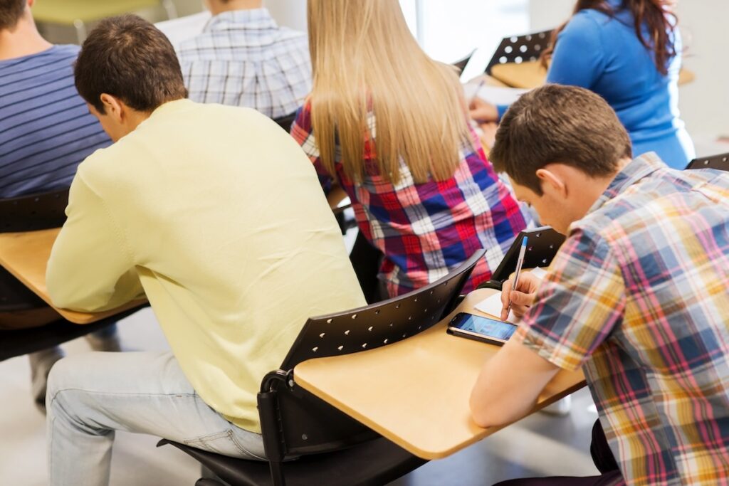 group of students writing test