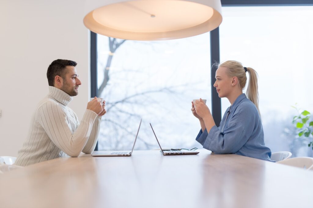 Group of a young business people discussing business plan at modern startup office building