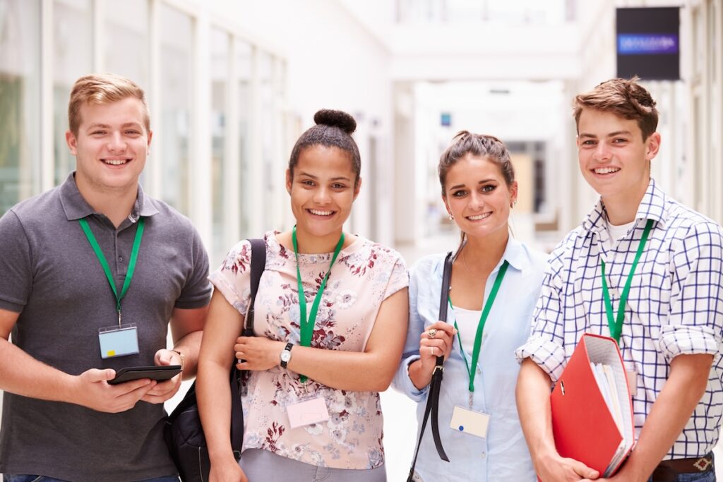 Portrait Of high school Students Standing In Hallway