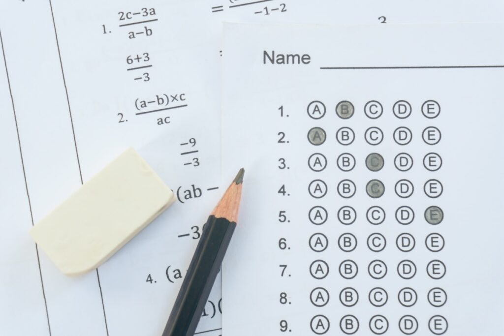 Standardized test form with answers bubbled. multiple choice answer sheet