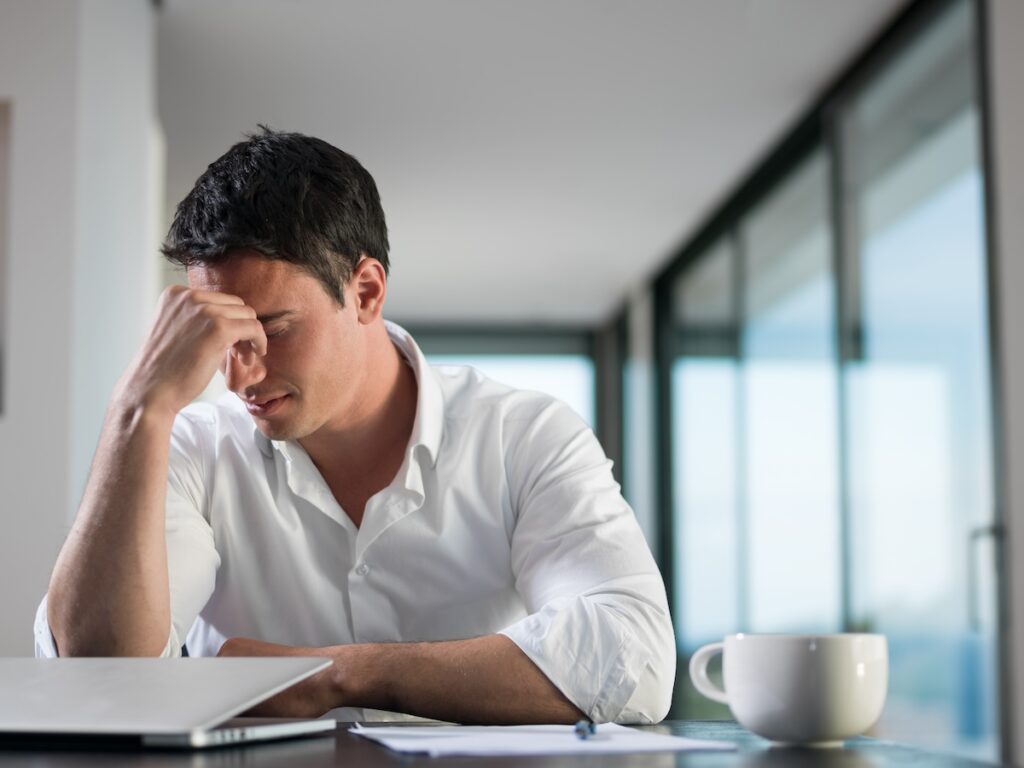 frustrated man working at home office