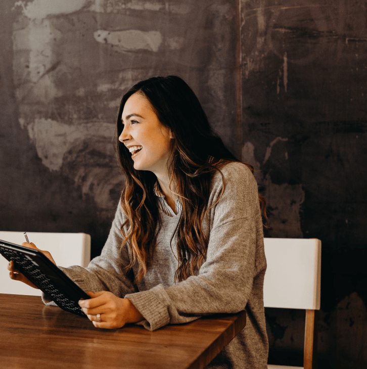 A happy women with notebook