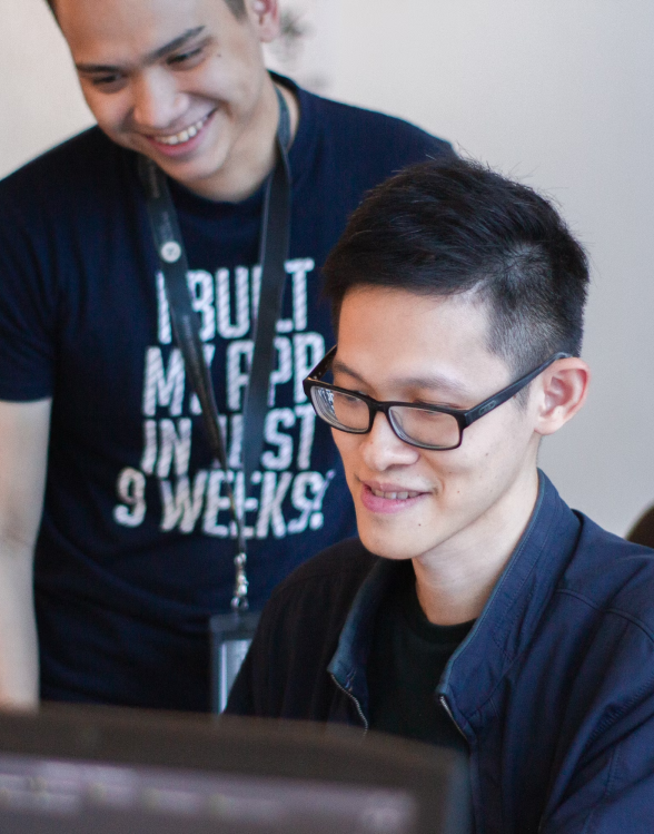 happy students talking at the computer