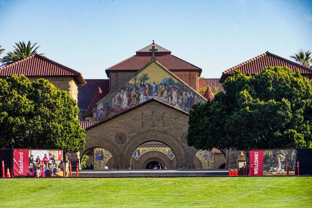 outdoor platform set up in front of beautiful stone building at Stanford University