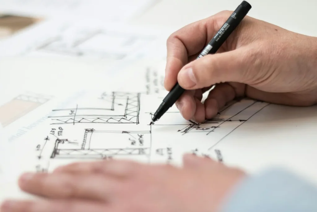 Best Architecture Schools in the US: A person drawing measurements on a paper