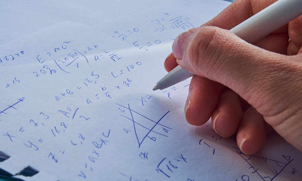 A focused student studying at a desk